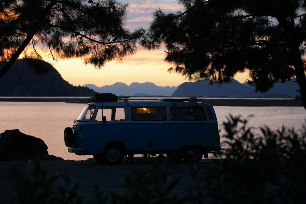 Volkswagen camper next to a lake